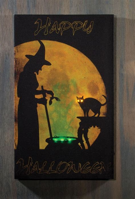 Get into the Halloween spirit with a mesmerizing light-up witch canvas